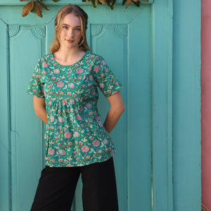 woman wearing black cotton top with round neck and cap sleeve