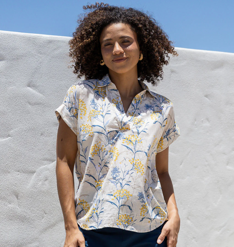woman wearing black cotton top with round neck and cap sleeve