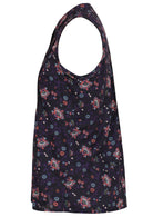 Side view of a sleeveless blouse with a floral print of pink, blue, and white flowers on a dark base 