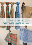 Scarf display with text overlay about free gift with orders over AU$200.

