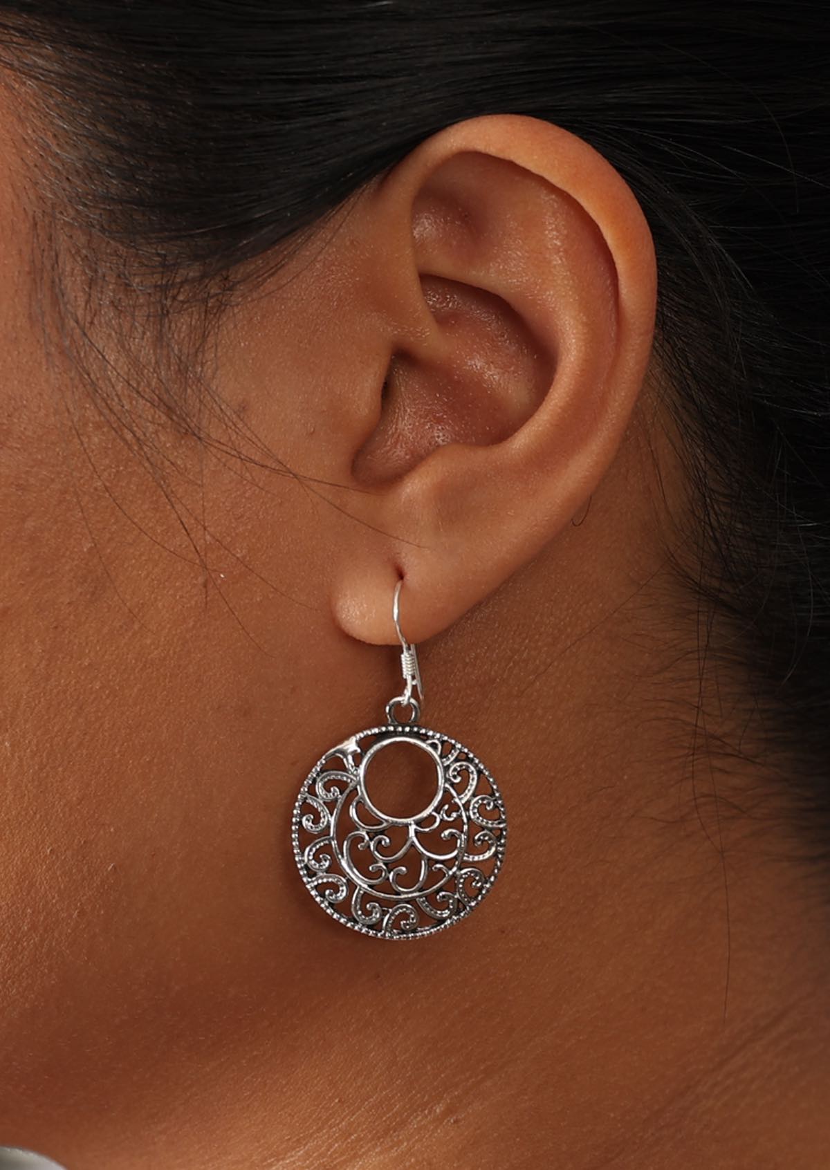 Sterling silver round earrings with offset cutout hole