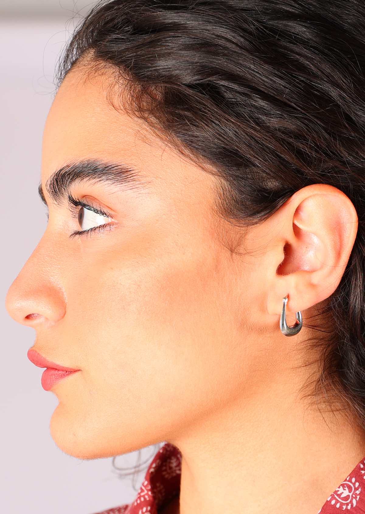Tapered hollow silver hoop earrings with trapezoid shape