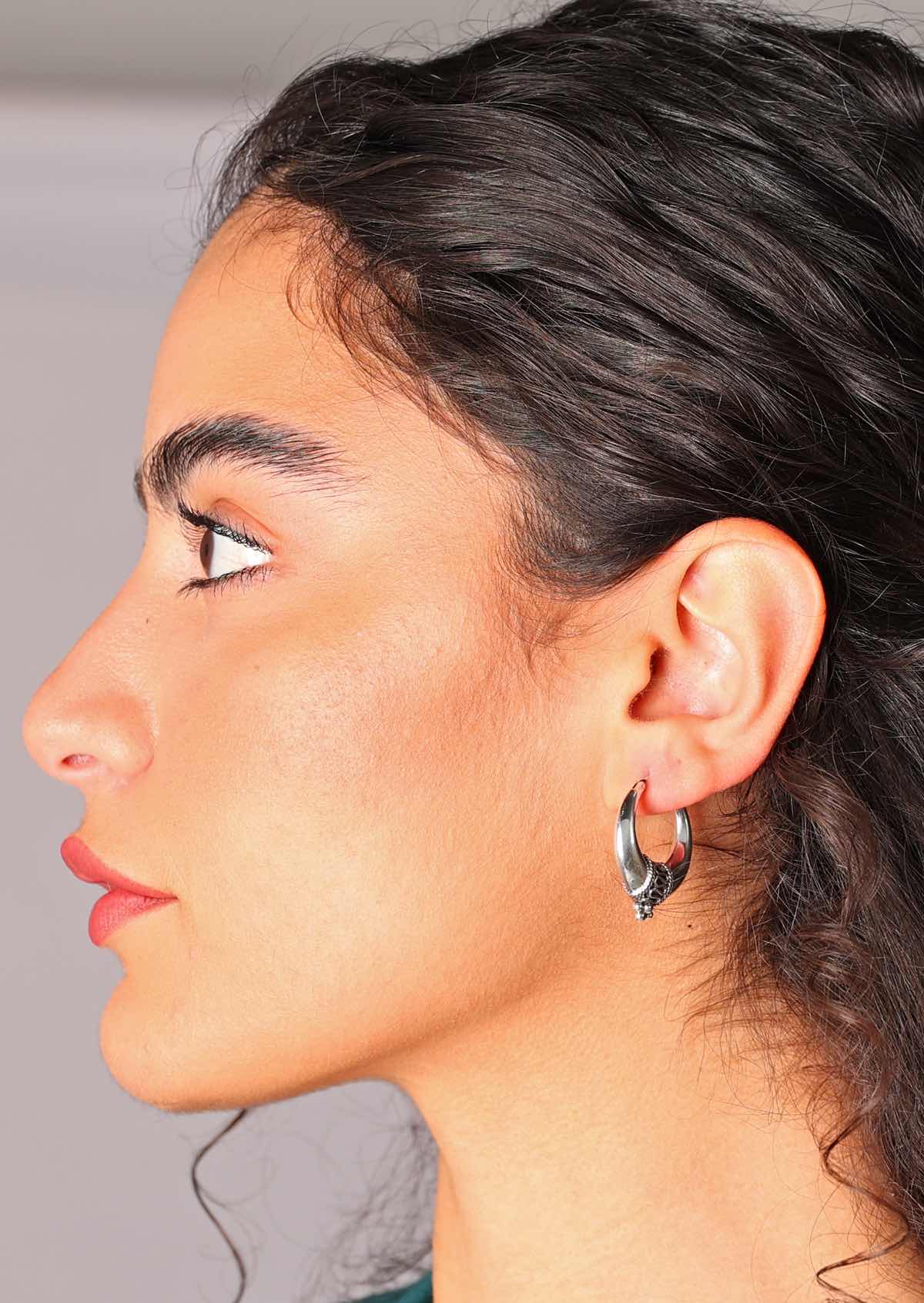 Gorgeous sterling silver hollow tapered hoop earrings with wire that secures closed
