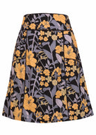 Black based floral print cotton A-line skirt with pockets and piped detail