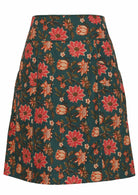 100% cotton above knee skirt with piped details, pockets and bold  pinkish florals on deep green base.