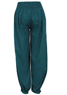 Back view of cotton relaxed fit pants in deep teal with buttoned ankles and elastic at back of the waist