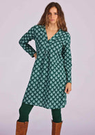 Long sleeve cotton tunic with white pendant print on dark green base