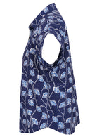 Side view of loose fit shirt style cotton top with collar in navy blue based floral print