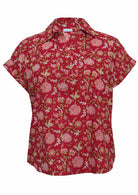 Front mannequin photo of cotton relaxed fit short sleeve top with V-neckline and collar