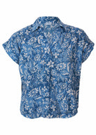 Front mannequin photo cotton relaxed fit short sleeve top with V-neckline and collar in blue floral print