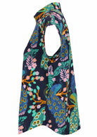 Side view of loose fit shirt style cotton top with collar in navy blue based floral print