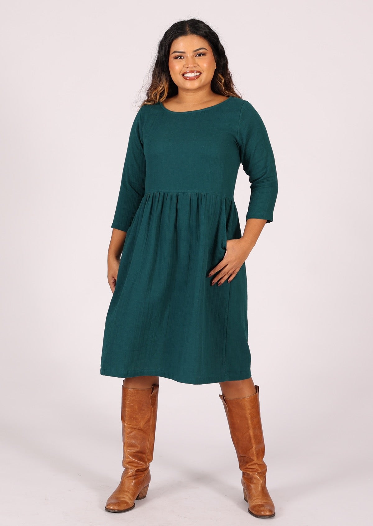 Model wears double layer cotton gauze dress with 3/4 sleeves and pockets
