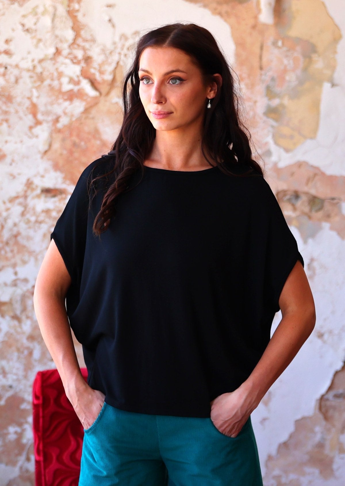 Woman wearing batwing t-shirt black in rayon 