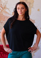 Woman wearing batwing t-shirt black loose fit
