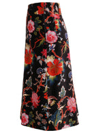 Side view of cotton velvet midi length A-line skirt with side zip, in multi-coloured Jacobean floral print on a black base