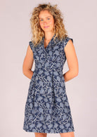 Model wearing cap sleeve Indian printed cotton Floral Dress with modest V-neckline