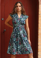 Retro cotton dress with cap sleeve and box pleats under waistband gives shape