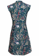 Back view of 100% cotton beautiful teal based floral dress with cap sleeves, side zipper and box pleats
