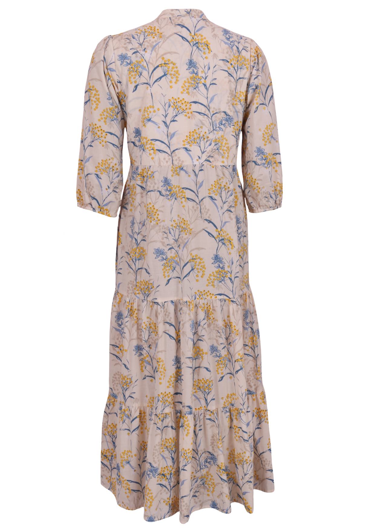 Back view of a full length maxi dress with 3 tiered flowy skirt, mandarin collar, buttoned bodice and pockets