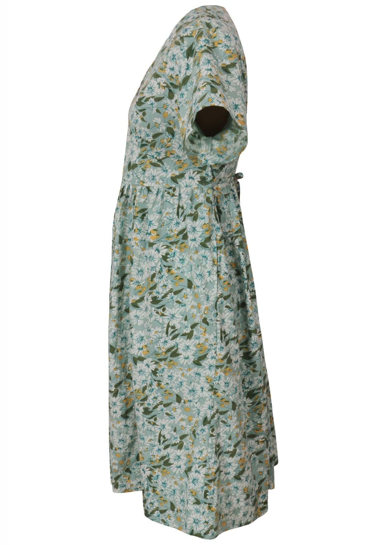 Side view of a pale mint green based floral cotton button through dress with short sleeves