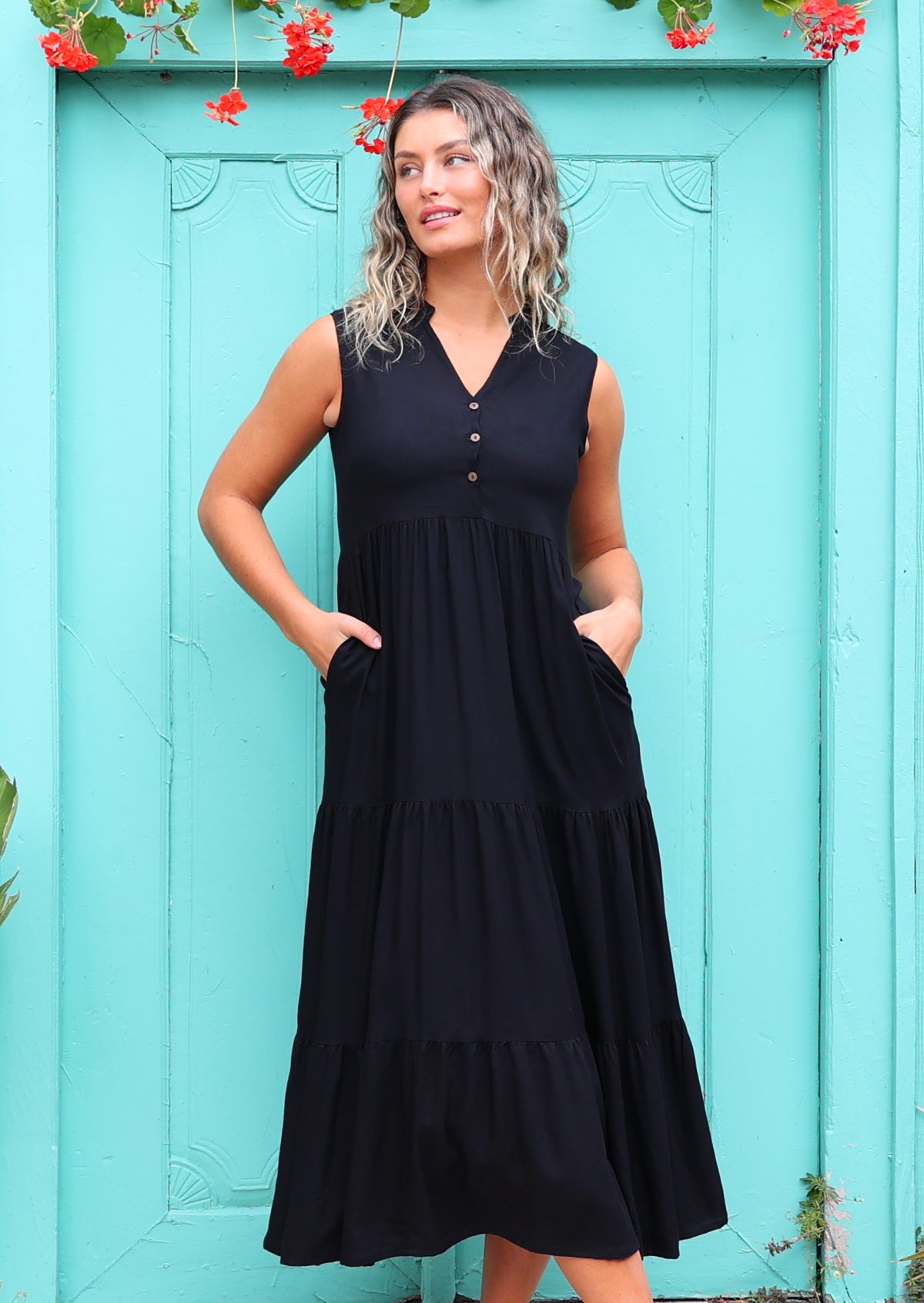 Woman in Black Rayon Maxi Dress with hands in pockets