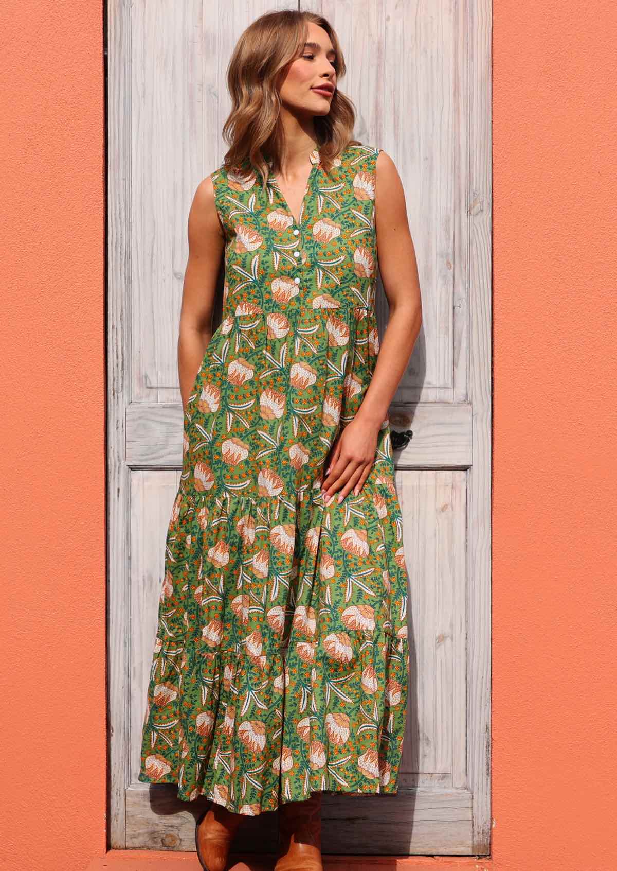 Make a statement in this beautiful green floral print sleeveless maxi dress with buttoned bodice