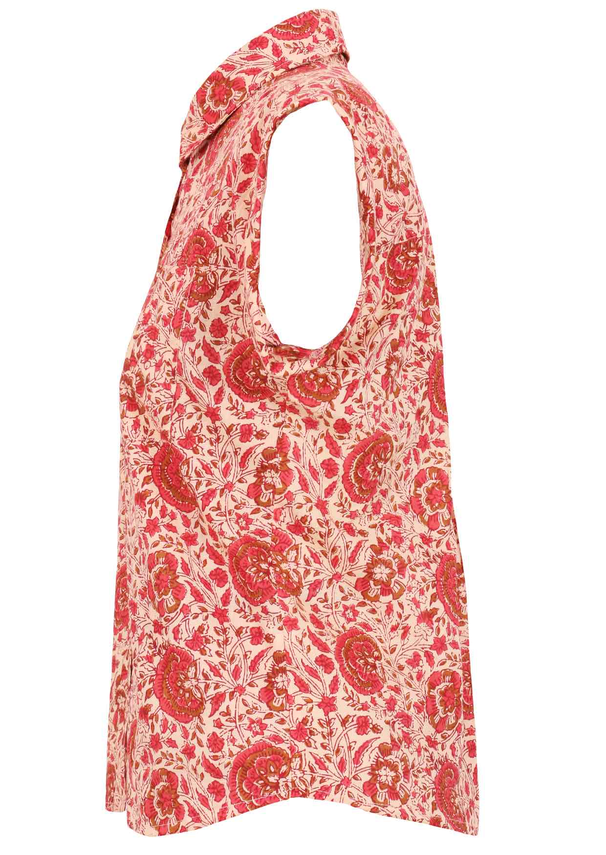 Side view of cream based warm floral print cotton shirt with cap sleeves