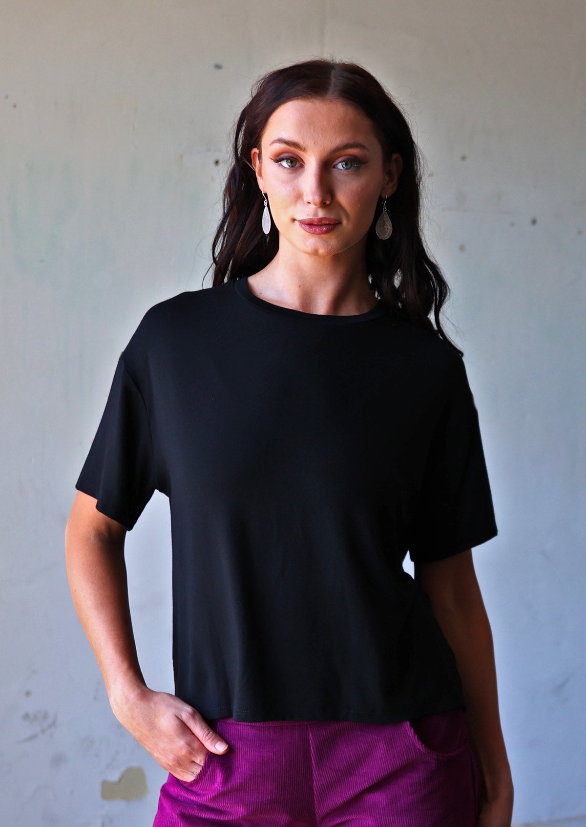 woman in loose fit black t-shirt with crew neck 