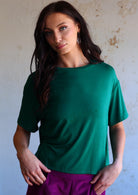 woman in jade green loose fit t-shirt 