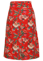 100% cotton knee length pencil skirt in red based floral print with side zipper and piped details across the waist and pocket