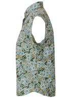 Side view of pale sage green based daisy print cotton button through shirt with collar and cap sleeves