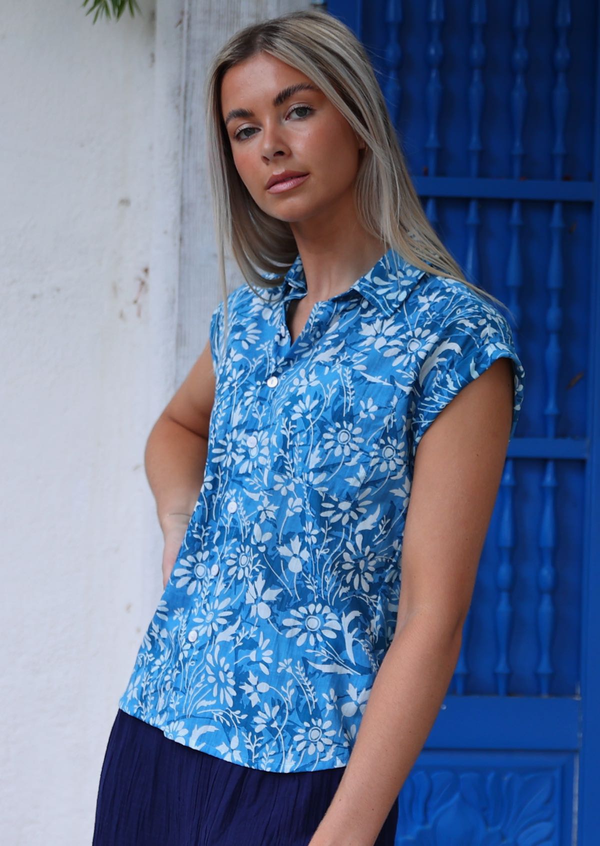 woman with blonde hair in blue 100% cotton button up blouse 