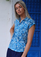 woman with blonde hair in blue 100% cotton button up blouse 