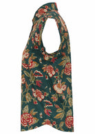 Side view of lightweight floral cotton button up shirt with folded cuff sleeves and one breast pocket 