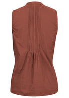 Back view of rust cotton sleeveless top with tiny decorative pleats in the center of the back 