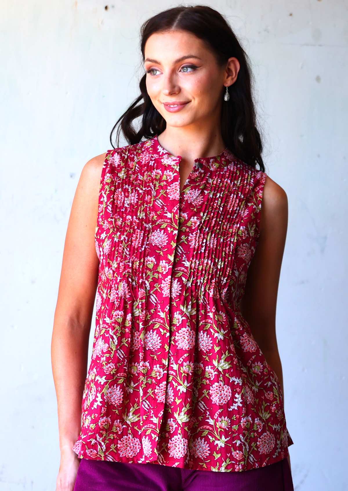 Woman in pink floral cotton sleeveless blouse