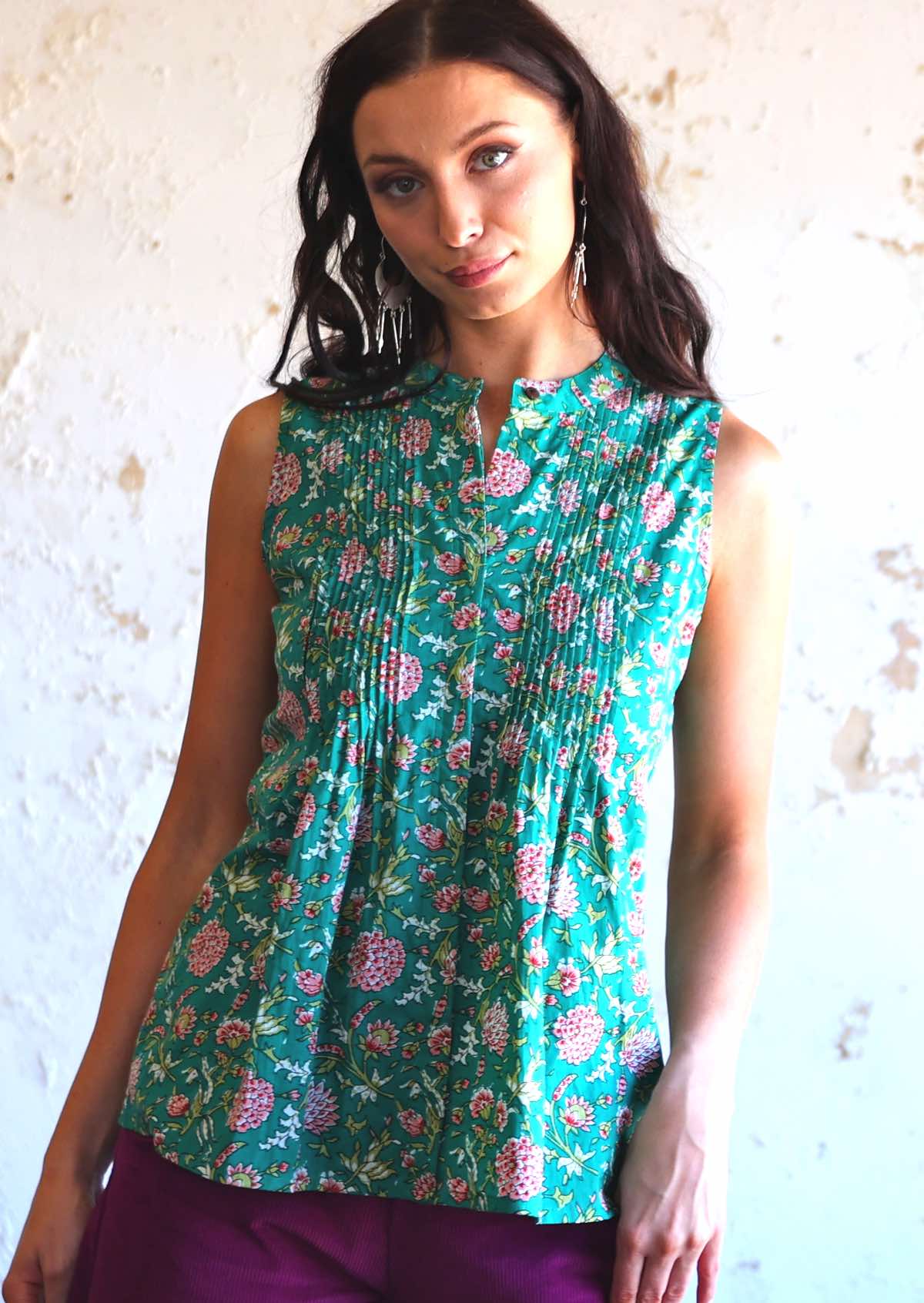 woman wearing green Indian cotton floral sleeveless blouse 