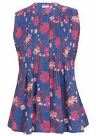 Sleeveless navy blue floral cotton top with button up collar, vertical small pleats and flared hem