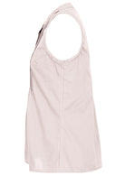 Side view of cotton sleeveless white top with high round neckline and flare below the bust