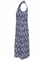 Sleeveless cotton, collared dress with button through front, pockets and gathers under the bust in navy blue based floral print