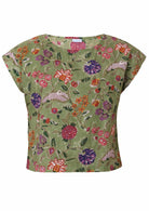 Green based multi-coloured folk style floral print cotton top with round neck.