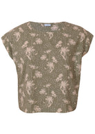 Front mannequin photo of cotton cap sleeve relaxed fit top in pale green based floral print