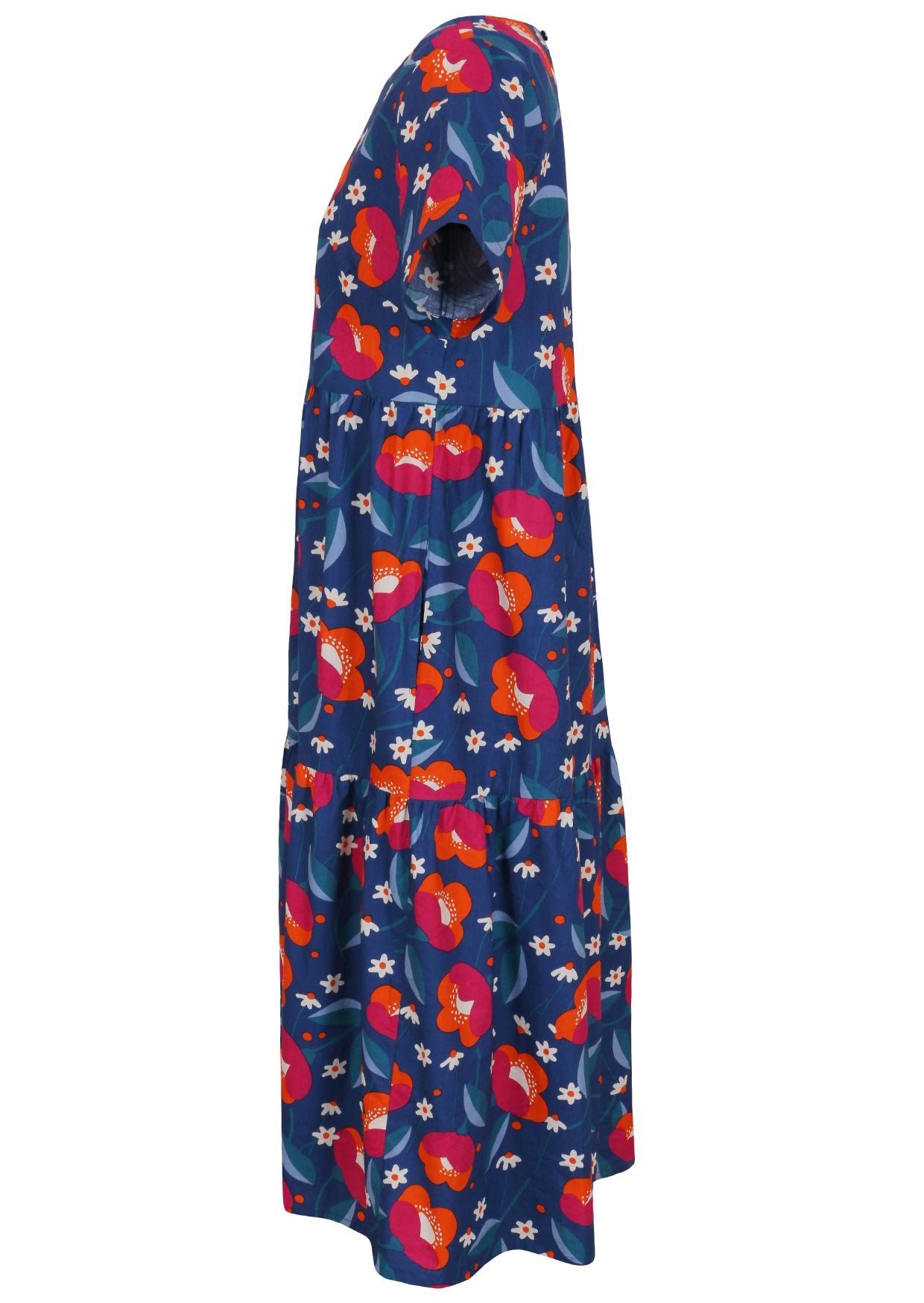Side view of cotton short sleeved midi length dress with empire waist and tiered skirt in royal blue based floral print
