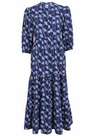 100% navy blue based floral three tiered flowy maxi dress with buttoned bodice, 3/4 sleeves and mandarin collar 