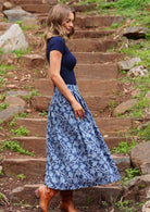 Model side on wearing Cora Skirt Neela navy button down 100 percent cotton maxi skirt 