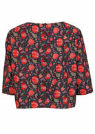 Back of cotton relaxed fit 3/4 sleeve top with decorative buttons, in a red and green floral print on a blue base 