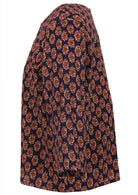 Side image of relaxed fit cotton top in beautiful pink, cream and brown florals on dark purple background.