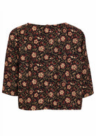 Loose fit, boxy cotton top with 3/4 sleeves   and decorative buttons down at the center of the back.