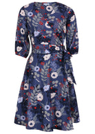 100% cotton wrap dress in blue with white flowers and long sleeves front view