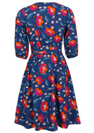 Back image of 3/4 sleeved cotton wrap dress with a flowing skirt and navy floral print.